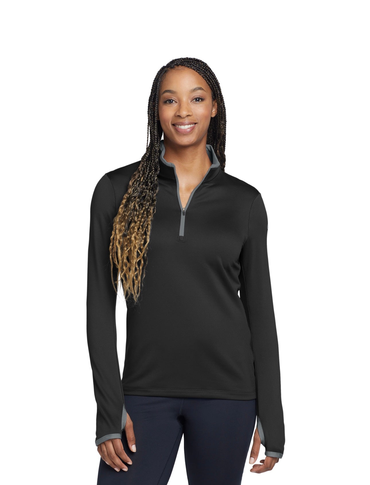 Woman wearing a black long-sleeve athletic shirt on a white background