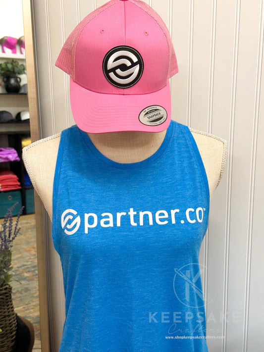 Mannequin wearing a blue 'partner.co' tank top with a pink cap featuring a logo.