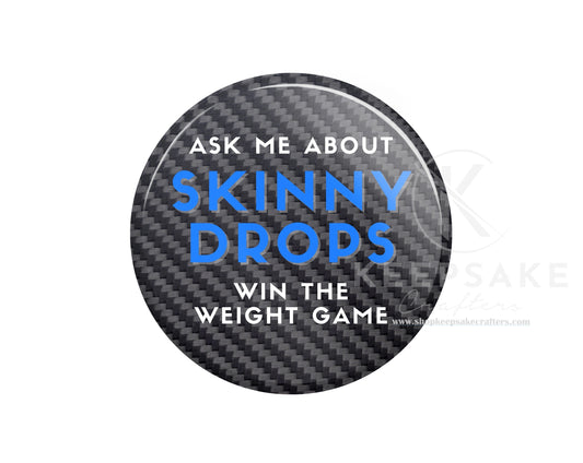 Black “Ask Me About Skinny Drops” Pin – Blue Lettering, Carbon Fiber Weave Background, Bold Print – Wellness & Weight Loss Conversation Starter