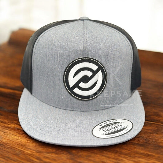 A gray flatbill cap with black mesh and a white embroidered design on the front.