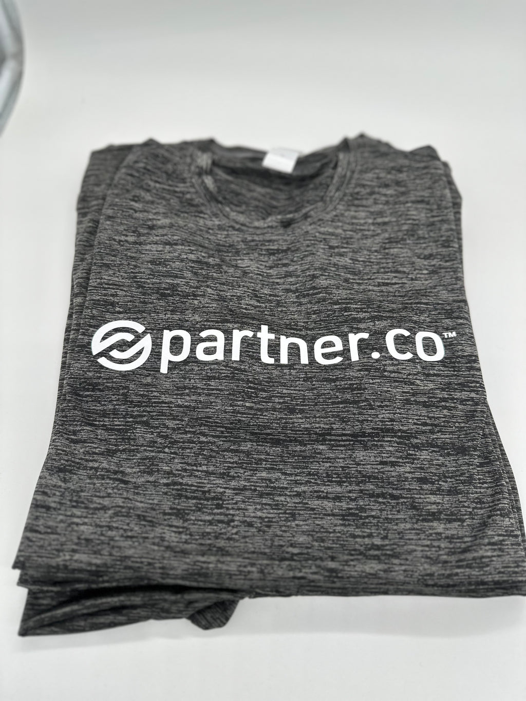 A gray t-shirt with the text 'partner.co' printed on the front.
