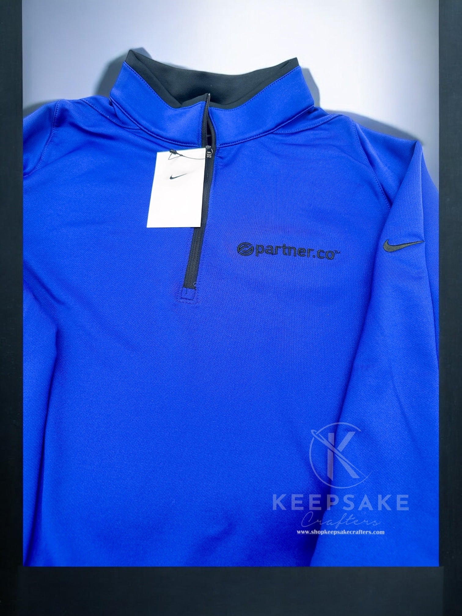 PartnerCo logo pullover on Blue Nike 